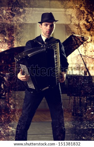man playing the accordion in the hall