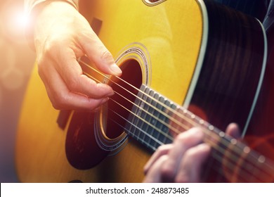 Man Playing An Acoustic Guitar