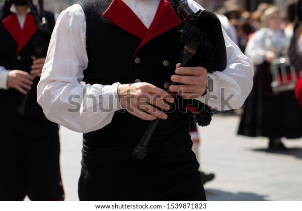 Man playing a bagpipes in Holy Week