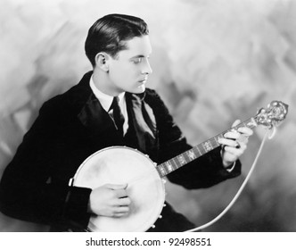 Man Playing A Banjo