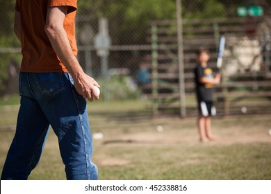 A Man Playing Baseball With His Son