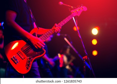 man playing bass guitar - Powered by Shutterstock