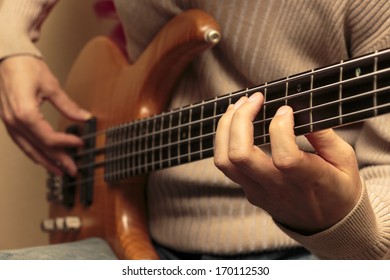 Man Playing A Bass Guitar (Series With The Same Model Available.)