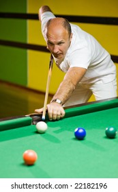 Man Playing Billiards