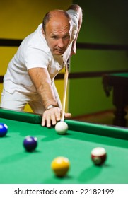 Man Playing Billiards