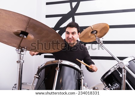 man playing drums