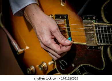 man playing an electric guitar - Shutterstock ID 1741820555