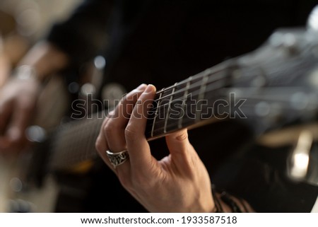 Man playing electric guitar on the stage