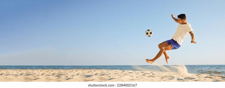 Man playing football on sandy beach, space for text. Banner design