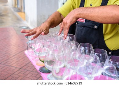 Man Is Playing A Glass Harp.