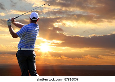 Man Playing Golf Against Sunset