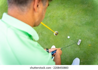 Man Playing Golf, Detail Of A Shot With The Putter On The Green, View From Above