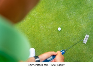 Man Playing Golf, Detail Of A Shot With The Putter On The Green, View From Above