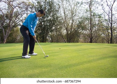 Man playing golf on a golf course