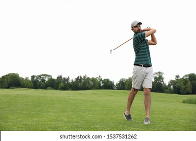 Man Playing Golf On Green Course. Sport And Leisure