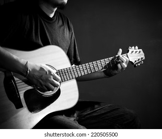 Man Playing Guitar. Black And White Photo.