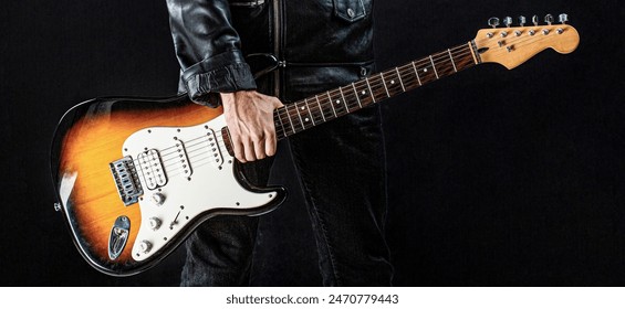 Man playing guitar. Hands of a musician playing the electric guitar. Electric guitar, guitarist, musician rock. Guitar acoustic. Rock band in action. - Powered by Shutterstock