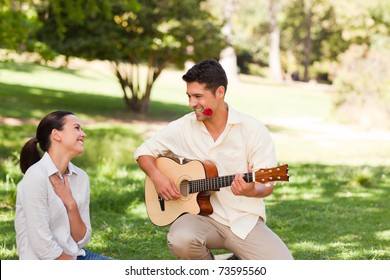 Man Playing Guitar For His Girlfriend