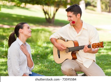 Man Playing Guitar For His Girlfriend