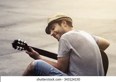 Man Playing Guitar On The Street. Retro Style.