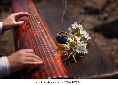 The Man Is Playing The Guqin