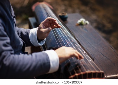 The Man Is Playing The Guqin