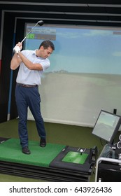 Man Playing Indoor Golf