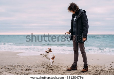 Similar – Foto Bild glücklicher Jack Russell Hund, der bei Sonnenuntergang auf einem Holzpier läuft.