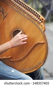 Man Playing Medieval Lute On The Street 