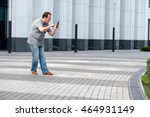 Man playing mobile game at the modern city background