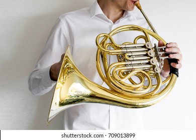 Man Playing On French Horn.