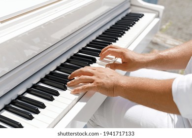 Man Playing Piano Outdoors On A Sunny Day. Celebration