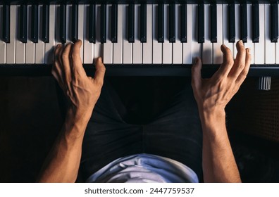 man playing piano. top view. - Powered by Shutterstock