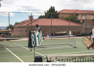 Man Playing Pickleball On A Court At A Country Club