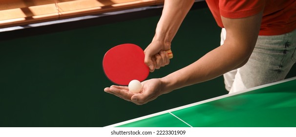Man playing ping pong indoors, closeup view. Banner design