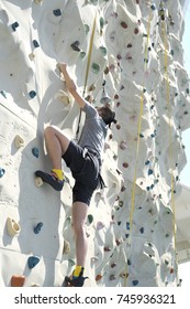 A Man Playing Rock Climb