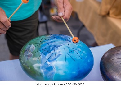 Man, Playing Steel Tongue Drum