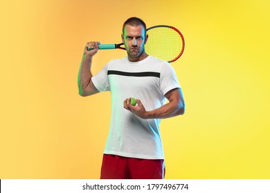 Man Playing Tennis Isolated On Studio Background In Neon Light