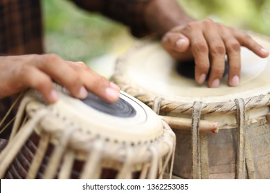 A Man Playing Traditional Indian Classical Musical Instrument - Tabla