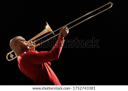 Man Playing Trombone side view