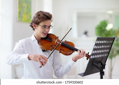Man Playing Violin. Classical Music Instrument. Teenage Boy Practicing Viola. Teenager Art School Student.