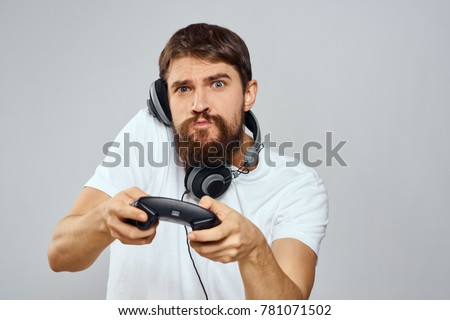   man plays the console on a light background, playstation, ps4                             