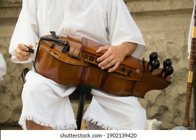 Man Plays A Hungarian Hurdy Gurdy