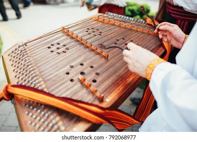 Man Plays On A Hammered Dulcimer