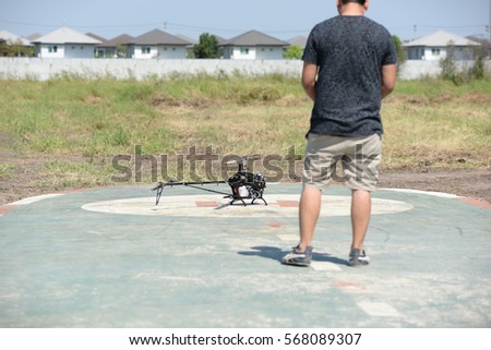 Man plays a remote control helicopter