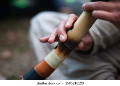 A Man Plays The Shakuhachi Flute.