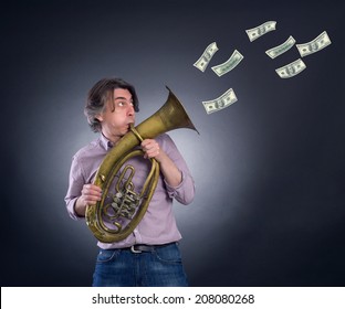 A man plays the trumpet blowing out her money.