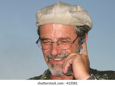 Man in Pleasing Conversation on Cell Phone