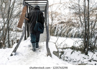 The man with the pointer goes over the bridge.