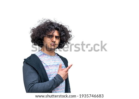 A man pointing to a blank plain background